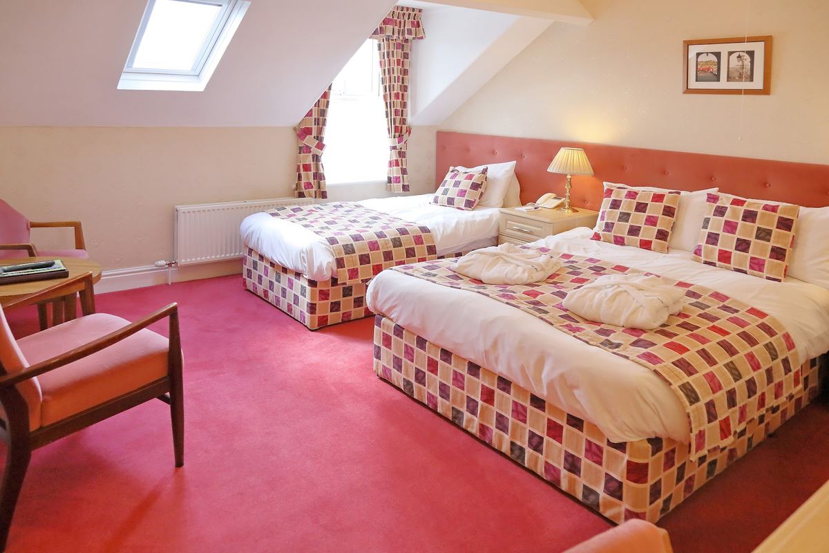 A twin room under the eaves at the Saxonville Hotel